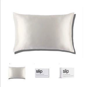 Two slip silk white queen sized pillow cases in original packaging. Never used.